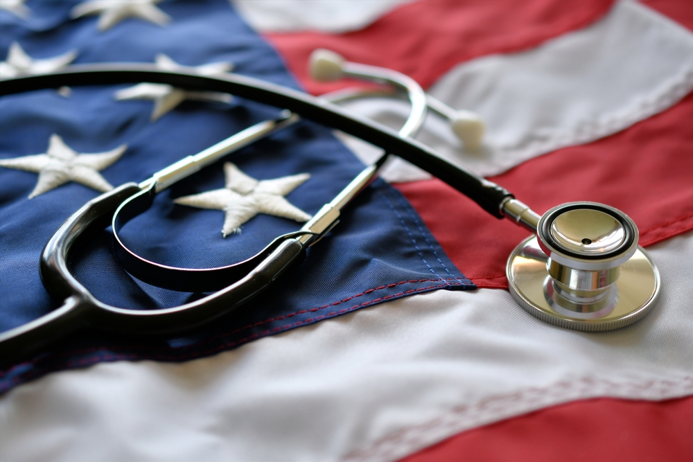 a United States of America flag with a stethoscope resting on top of it